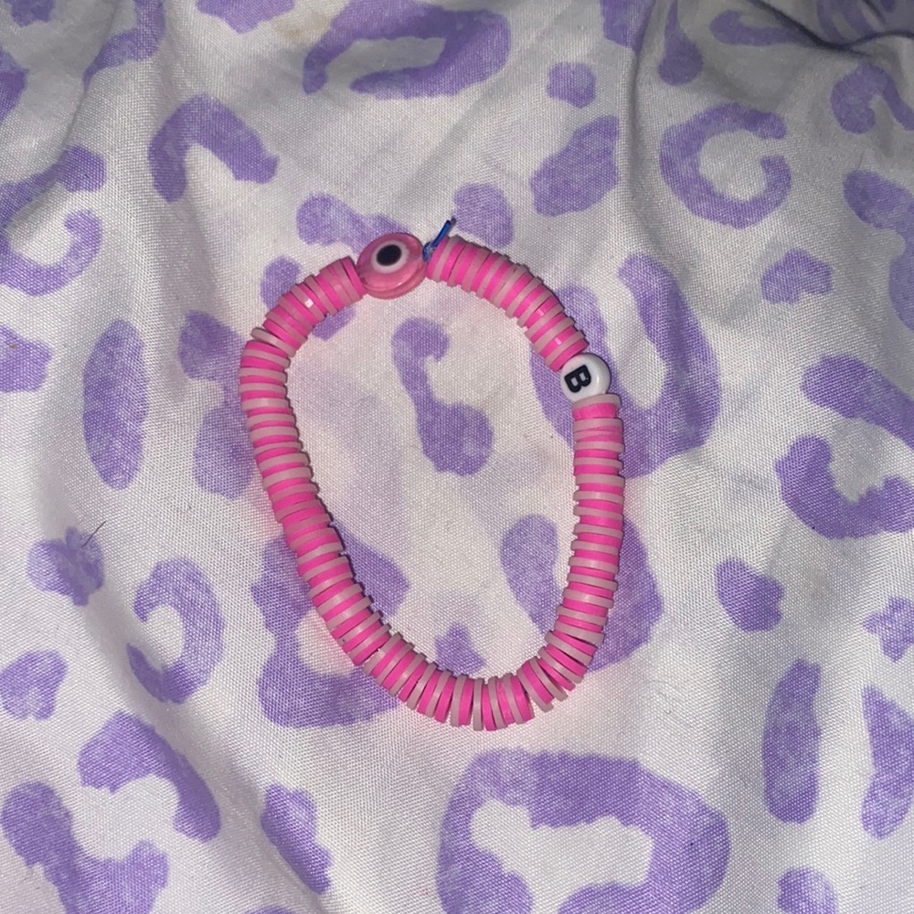 A pink Barbie evil eye bracelet